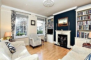 Period reception room featuring wooden flooring, high ceilings, sash windows, classical decorative fireplace. Close to this four bedroom Kennington town house is excellent transport links, green spaces and wining, dining and retail outlets